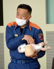 講話する丸山主幹